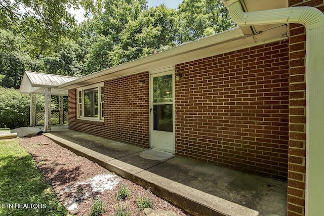 view of side of property with a patio