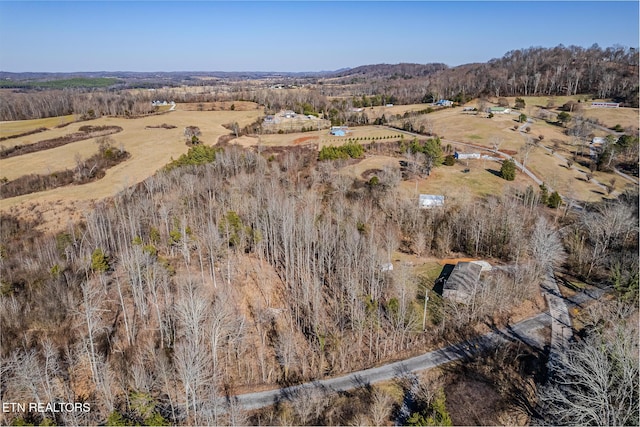 birds eye view of property with a rural view