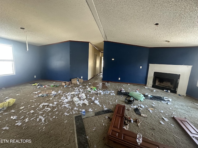 unfurnished living room featuring a textured ceiling