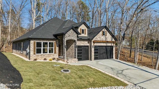 view of front of home featuring a garage and a front lawn