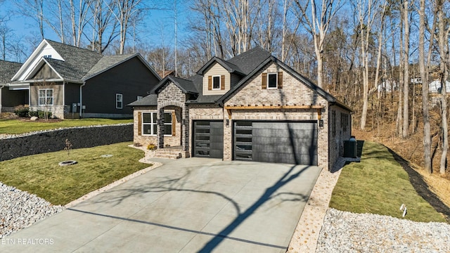 view of front of property featuring a garage, a front lawn, and central AC unit