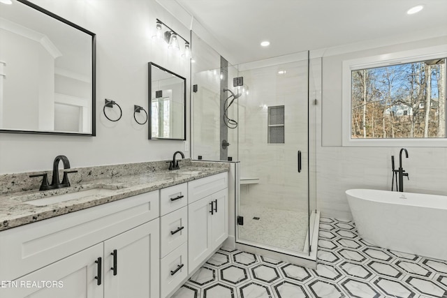 bathroom featuring vanity, crown molding, and separate shower and tub