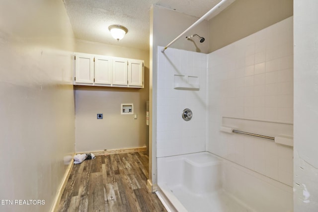 bathroom featuring walk in shower, a textured ceiling, and hardwood / wood-style flooring