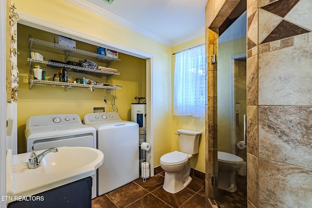 bathroom featuring toilet, tile patterned floors, washer and dryer, a shower, and ornamental molding