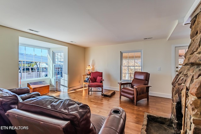 living room featuring a healthy amount of sunlight and hardwood / wood-style flooring