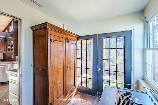 doorway to outside featuring french doors and dark wood-type flooring