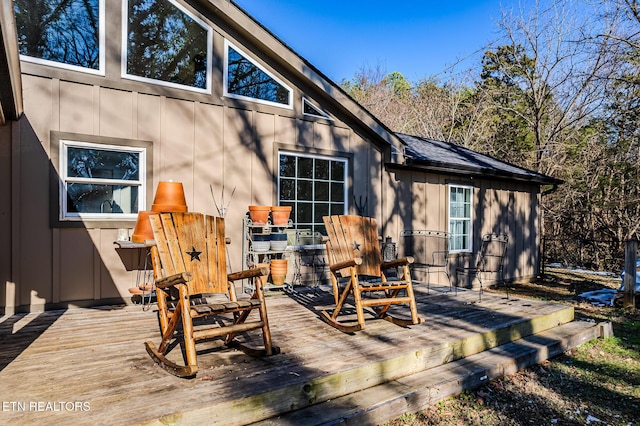 rear view of property with a wooden deck