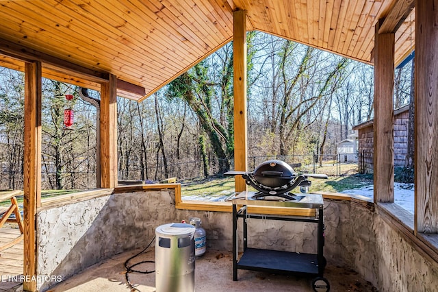 sunroom / solarium with lofted ceiling and wood ceiling