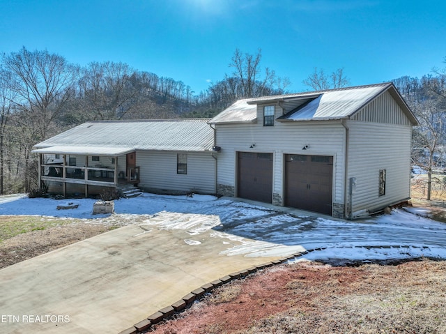 view of front of house with a garage and a porch