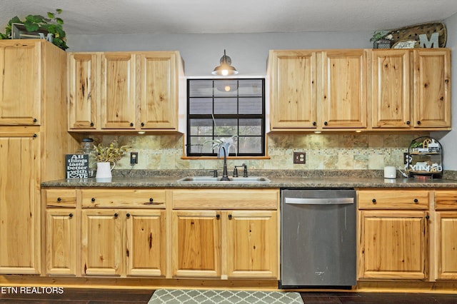 kitchen featuring decorative backsplash, dishwasher, sink, and light brown cabinets