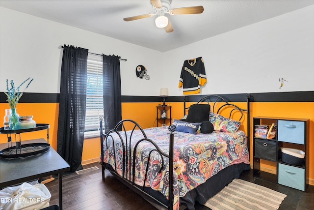 bedroom featuring ceiling fan and dark hardwood / wood-style flooring