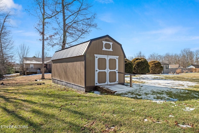 view of outbuilding with a lawn