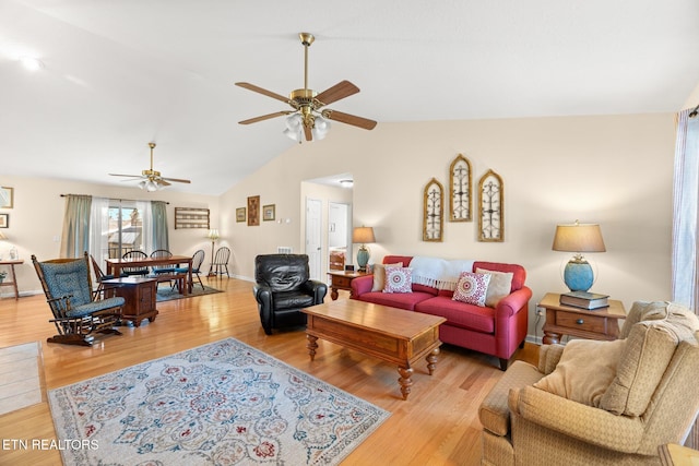 living room with light wood-type flooring, ceiling fan, and lofted ceiling