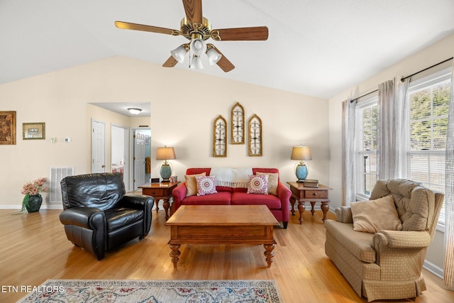 living room with light wood-type flooring, ceiling fan, and lofted ceiling