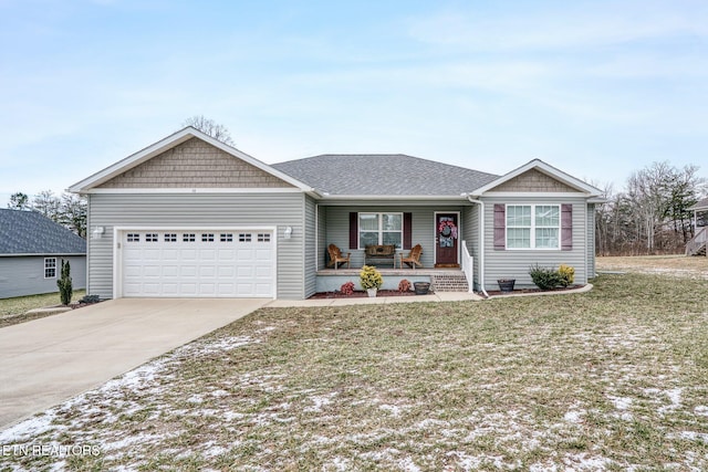 ranch-style house featuring a garage, a front yard, and a porch