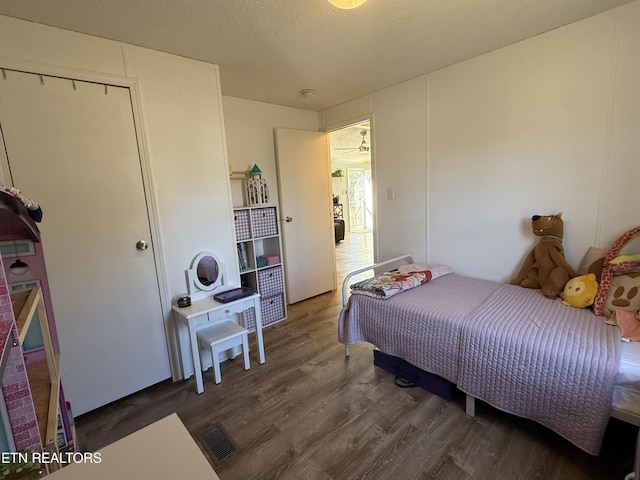 bedroom featuring dark hardwood / wood-style floors