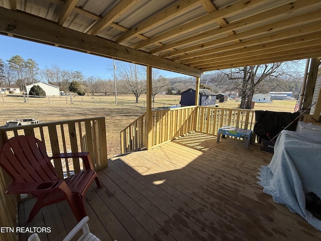 wooden deck with a shed