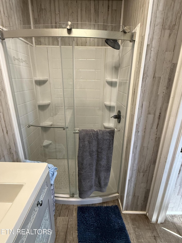 bathroom with an enclosed shower and vanity