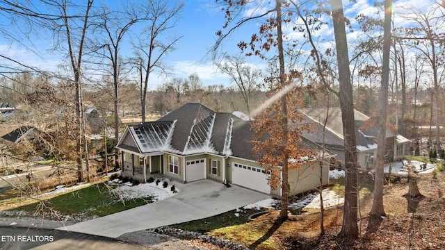 view of front of house with a garage and a porch