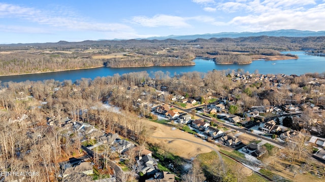 drone / aerial view with a water and mountain view