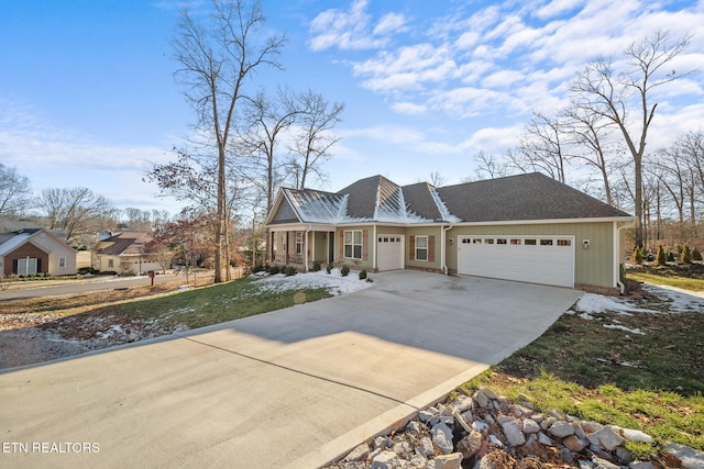 view of front of home featuring a porch and a garage