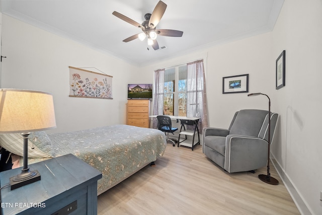 bedroom with ceiling fan, ornamental molding, and light hardwood / wood-style flooring