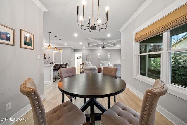 dining space with ceiling fan, plenty of natural light, ornamental molding, and light hardwood / wood-style floors