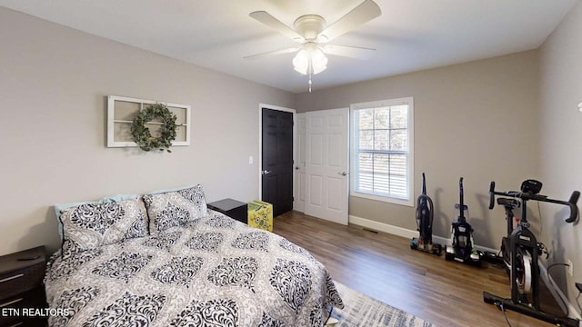 bedroom with wood-type flooring and ceiling fan