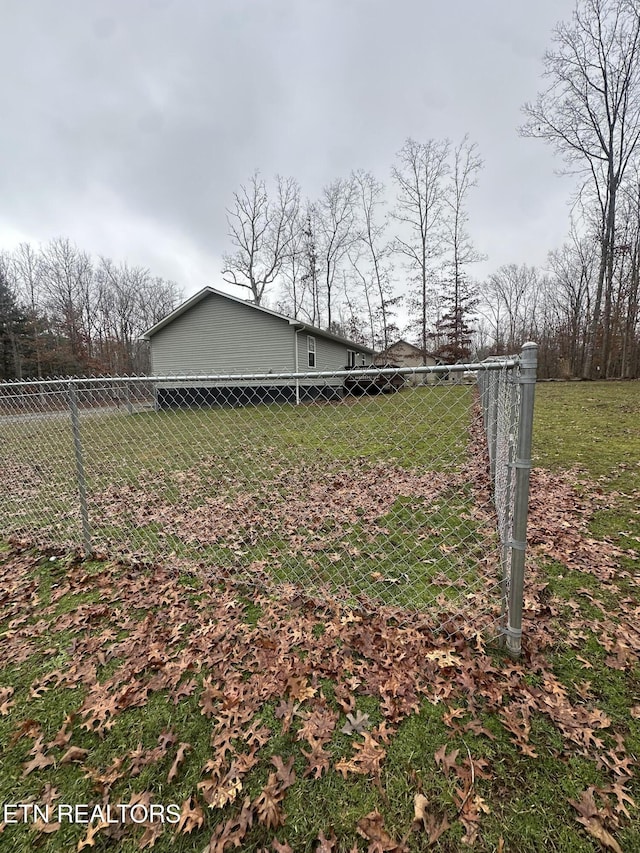 view of property exterior with a yard