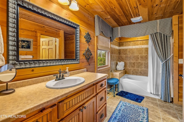 bathroom featuring wood ceiling, wooden walls, vanity, tile patterned floors, and a bathing tub