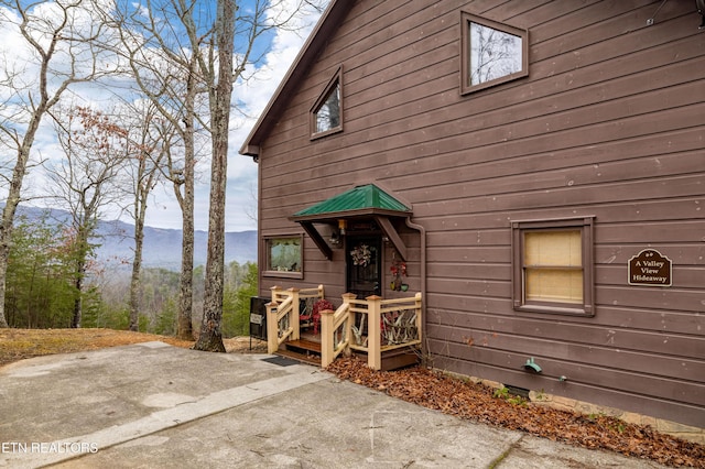 exterior space with a mountain view and a patio