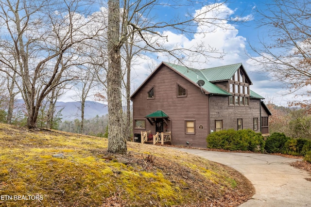 view of home's exterior featuring a mountain view