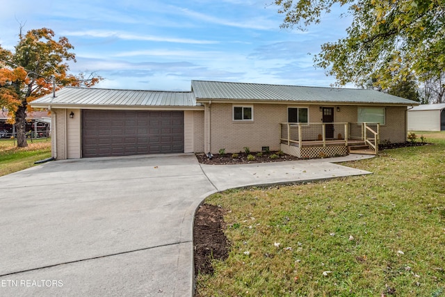 single story home featuring a front yard and a garage