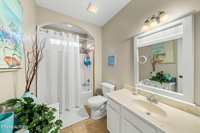 full bathroom featuring toilet, vanity, shower / bathtub combination with curtain, and tile patterned flooring