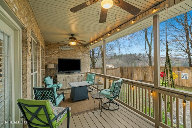 wooden deck with ceiling fan