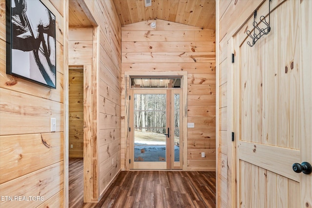 doorway with lofted ceiling, dark hardwood / wood-style flooring, wood walls, and wooden ceiling