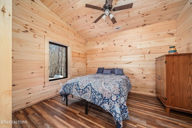 bedroom featuring wooden walls, ceiling fan, wooden ceiling, dark hardwood / wood-style flooring, and lofted ceiling