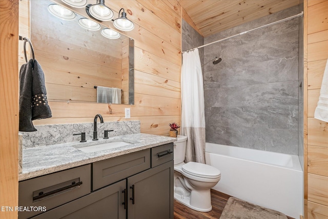 full bathroom featuring hardwood / wood-style floors, vanity, shower / bath combination with curtain, wooden walls, and toilet