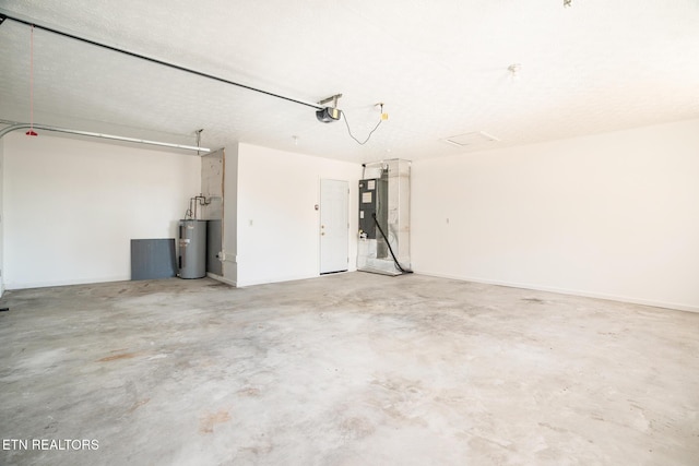 garage featuring a garage door opener, electric water heater, and heating unit