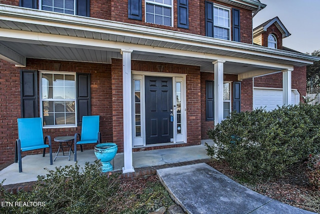 doorway to property with covered porch