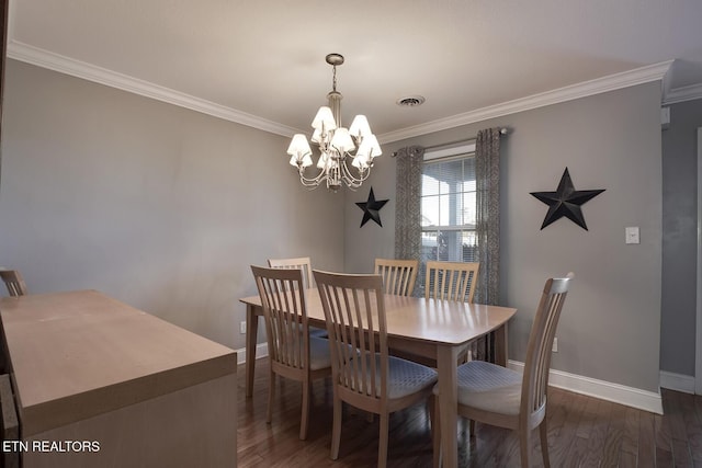 dining room featuring a notable chandelier, ornamental molding, and dark hardwood / wood-style floors