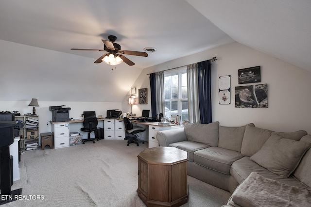 home office featuring lofted ceiling, light carpet, and ceiling fan