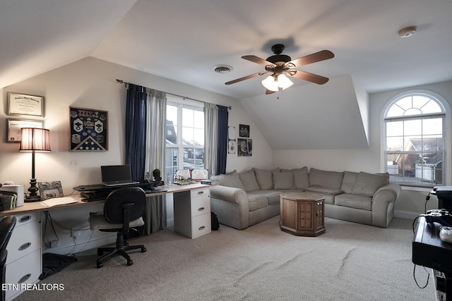 carpeted office featuring ceiling fan and vaulted ceiling