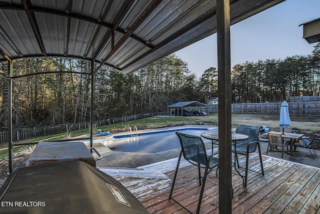 view of swimming pool featuring a deck