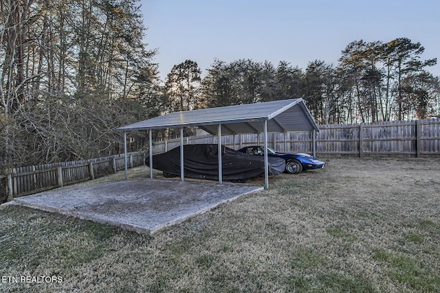 view of vehicle parking featuring a carport and a lawn