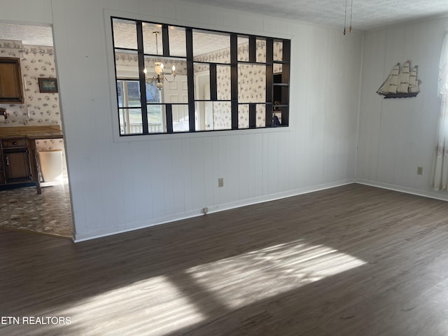 unfurnished room with dark hardwood / wood-style floors