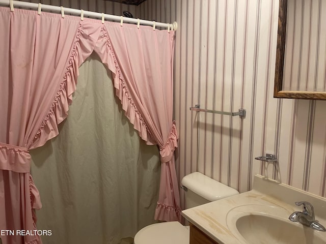 bathroom with vanity and toilet