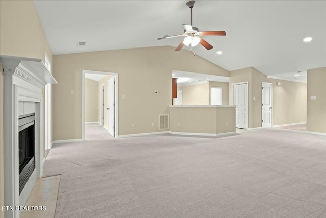 unfurnished living room with ceiling fan, lofted ceiling, and light carpet