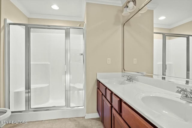 bathroom with vanity, crown molding, tile patterned floors, and walk in shower