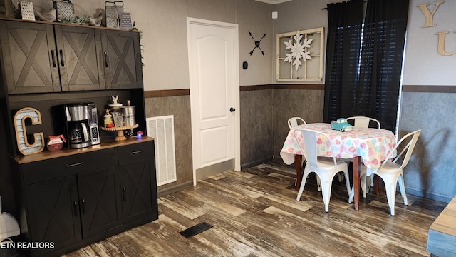 dining room with dark wood-type flooring